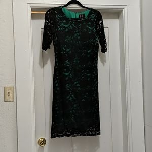 Black lace dress with green under layer
